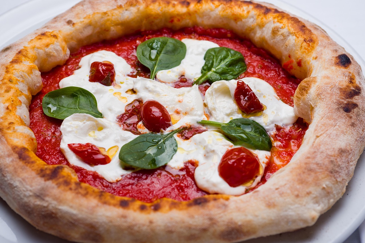Pepe in Grani — burrata, San Marzano, basil on the wood-fired crust